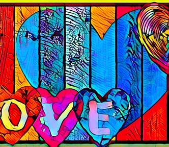 The word LOVE in colored hearts in front of a colored paneled fence