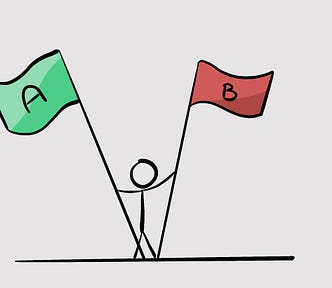 Stick figure holding up a green and red flag with an A and a B written on them