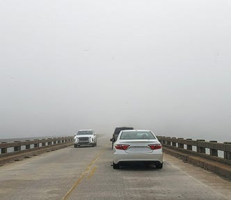 Fog on a bridge obscures the destination.