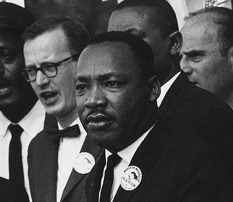 Detail of a black and white photo, c.a. 1963, of Dr. King at the Civil Rights March in Washington, D.C., surrounded by other notable public figures present at The March.
