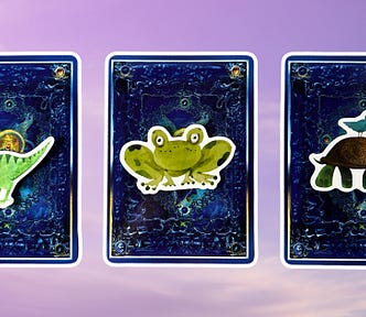 Three pick a card piles from the Angel Tarot: pile 1 — dinosaur, pile 2 — frog, and pile 3 — turtle