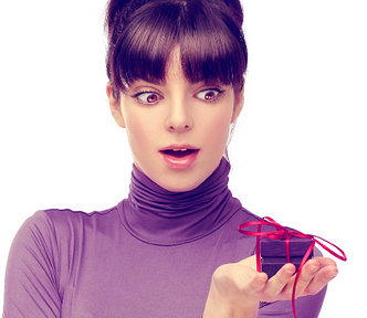 Woman in purple shirt holding a tiny purple gift — How Oral Sex Feels To Men