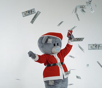 When I write about writing, I feel like this plush grey bear in Santa Suit that’s throwing money around.