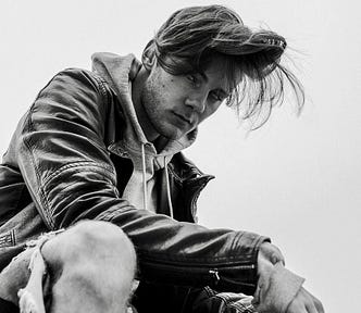 Photo of drunk man in torn jeans