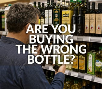 A man choosing between two bottles of olive oil in a grocery store.