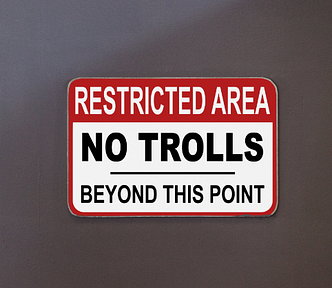 A sign saying Restricted Area, No Trolls beyond This Point