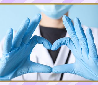 A medical professional making a heart with her hands.