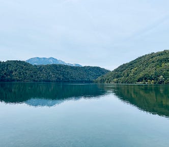 A photo of Lake Levico’s clear blue waters captured by the author