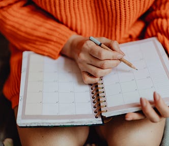 girl writing in a planner
