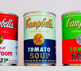three vintage bright cans of Campbell’s soup from Andy Warhol