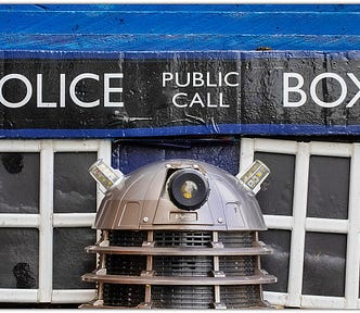 Photograph of The Tardis ‘Police Box’ with a Dalek standing in front in reference to the BBC TV series ‘Doctor Who’