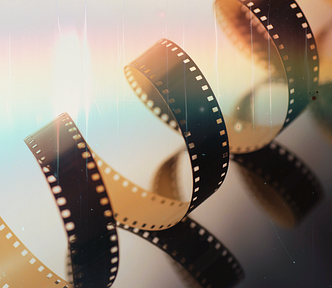 An image of a strip of camera film and rainbow hue.