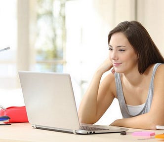 Photo of white female looking at computer