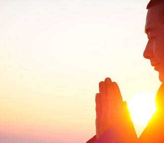 A buddhist monk praying