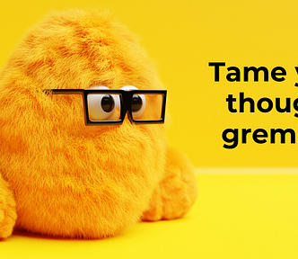 An orange fluffy gremlin wearing square glasses stares at the words “Take your thought gremlins”