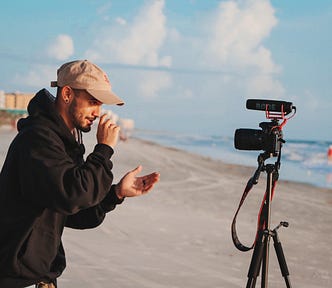 Person recording themselves on a beach