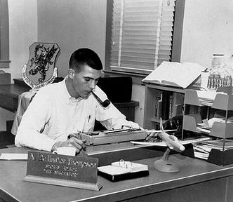 A young U.S. serviceman — who happens to be gonzo writer supreme Hunter S. Thompson — sits at a desk, pipe in mouth, staring at his typewriter, symbolising the dreams of any young author.