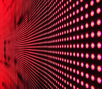 a pattern of red lights on black background