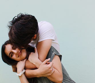 young couple holding and kissing