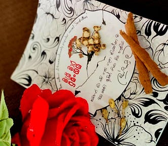 A Red Flower, Spices and a Book