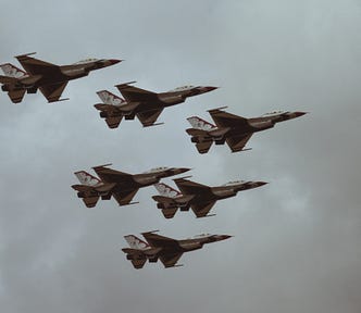 A picture of six fighter jets.