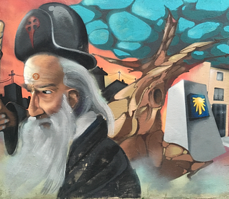 a pilgrim, with turquoise sky and the camino de santiago shell on a pillar. This is a mural