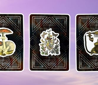 Three oracle pick a card piles: pile 1 — mushroom, pile 2 — butterflies, and pile 3 — phone