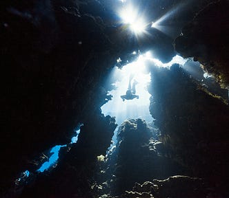 Image of a deep sea diver. Designers need to dig deeper in order to uncover issues with products. Image credit: NEOM, Unsplash