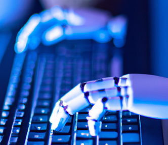 A humanoid robot types on a computers keyboard, the mood of the picture is futuristic