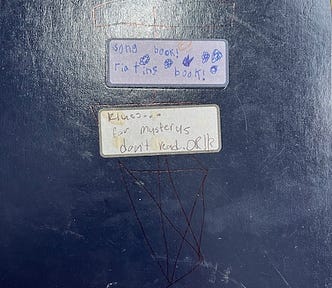Label on a journal of songs, riating, and klues for mysteries all misspelled by a young scribe