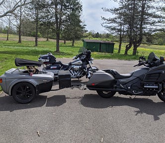Goldwing motorcycle with a trailer for a dog to ride in.