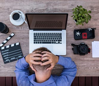 From the medium blog of Federico Trotta: a man struggling in front of a computer.