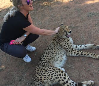Image of the author patting a cheetah
