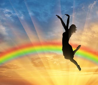 Happy Woman Jumping Near Rainbow