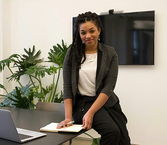 A female executive smiling at the camera.