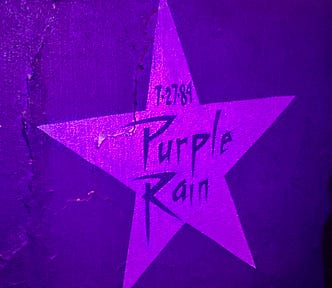 Purple Rain star dated 7–27–84 on a wall inside First Avenue nightclub and music venue in Minneapolis, Minnesota, USA.