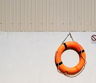 A lifebuoy hanging on a wall.