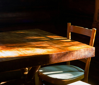 A wooden Dinner Table with chair