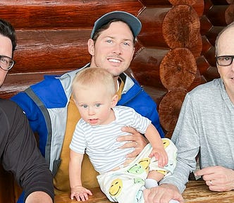 Photo of the author, his sons and grandson