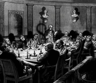 A smoke-filled room lit by candles. Around a large formal table sit various 19th century gentlemen-type people. One of them stands and reads from a memo. The shadow he casts is in the shape of a dollar-sign.