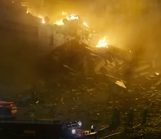 Scene of burning buildings at Chernobyl nuclear reactor site.