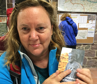 Tired woman holds pilgrim passport