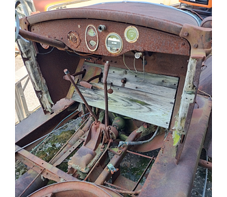 The vehicle in the photo is one I took at my mechanic’s place of a Star Car by Durant Motors, circa late 1920s. It shows the front seat area, though the seats are missing. It is quite rusty and many of the floorboards (which are actual wooden boards) are missing, too.