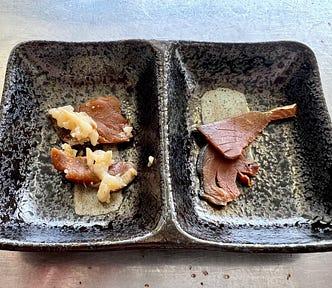 Thin slices of narezushi and heshiko.