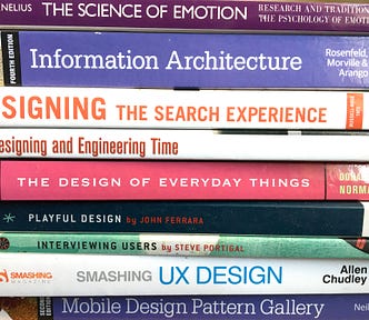 An image of a pile of UX books. Source: medium/@h_locke