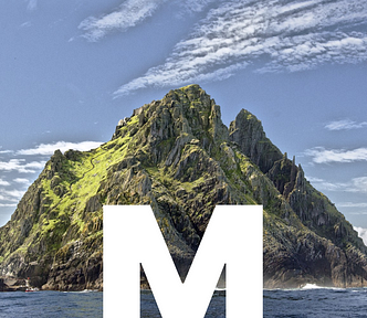 An island, possibly Neverland with a big M for Microcosm added by Zane Dickens