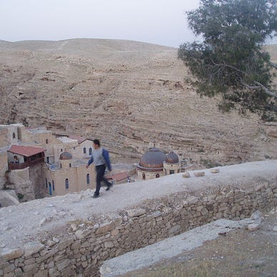 The author walking alongside the Mar Saba Greek Orthodox Monastery (Photo by ‘Charlene’ on behalf of the author, 2004)