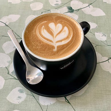 Latte with clover foam