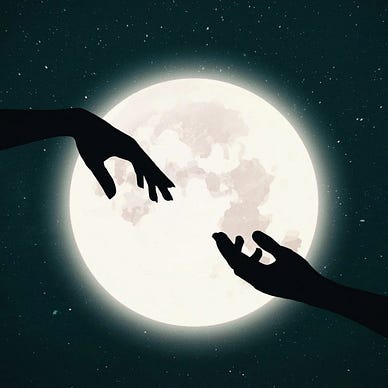 Two hands reaching out across a full moon.