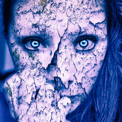 The woman’s mask she wore is cracking.